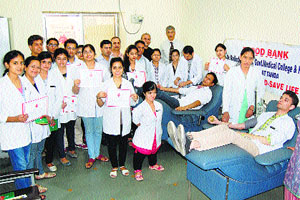 Students donate blood on the first day of a month-long blood donation programme at the DRPGMC at Tanda in Kangra on Wednesday. 