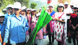 Deputy Commissioner M Sudha Devi flags off a cleanliness drive at Sarol in Chamba district.