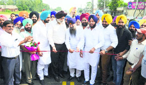 Cabinet Minister Sharanjit Singh Dhillon (centre) inaugurates Dhuri railway overbridge in Ludhiana on Wednesday.