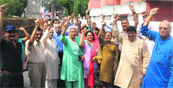 Senior citizens protest against water-logging problem at Suryalok Colony in Dehradun on Wednesday. Tribune photo: Vinod Pundir