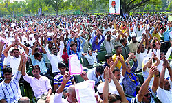 People taking a pledge for cleanliness along with Prime Minister Narendra Modi (seen on a screen) during the launch of the nationwide campaign, at Rajpath in New Delhi on October 2