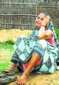 A file photo of a woman protesting against the demolition of her betel vineyard for the proposed Posco steel project in a village near Paradip.
