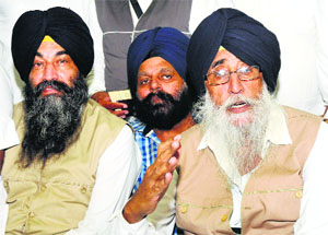 SAD (Amritsar) chief Simranjit Singh Mann (right) addresses a press conference in Karnal on Thursday. 