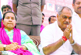 HJCP chief Venod Sharma with his wife Shakti Rani Sharma during a rally in Kalka on Thursday.
