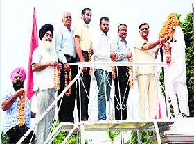 Former minister Manoranjan Kalia garlands the statue of Father of Nation on the occasion in Jalandhar on Thursday. 