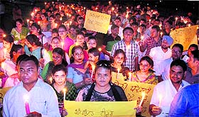 Activists of the Computer Teachers Front take out a candlelight march in Jalandhar on Thursday. 