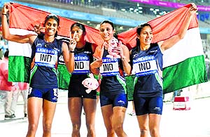 Gold medallists Poovamma Machettira, Tintu Lukka, Mandeep Kaur and Priyanka Pawar celebrate their victory in the 4x400m relay in Incheon on Thursday.