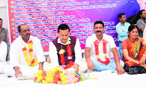 Mayukh Mahar, Congress legislator from Pithoragarh, sits on a dharna at Pithoragarh on Thursday.