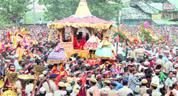 Devotees pull the wooden chariot of Lord Raghunath during the Dasehra celebrations in Kullu on Friday. A Tribune photo