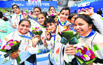 Women kabaddi players pose with their gold medals at the 17th Asian Games in Incheon on Friday