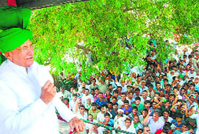 INLD chief Om Prakash Chautala addresses a rally at a village in Jind.