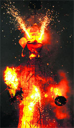 Effigy of Ravan set ablaze during the Dasehra celebrations at the Government Training Institute in Jalandhar on Friday. Tribune Photo: Malkiat Singh