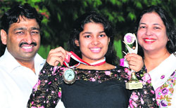 Kuhoo Garg with her parents. Photo: Malkiat Singh