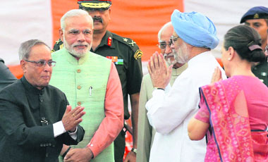 President Pranab Mukherjee exchanges greetings with Vice-President Hamid Ansari, Prime Minister Narendra Modi, former PM Manmohan Singh and Congress president Sonia Gandhi upon his arrival for Dasehra celebrations at Subhash Maidan in New Delhi on Friday.