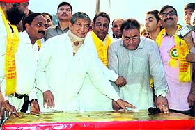 Uttrakhand Chief Minister Harish Rawat sets on fire effigy of Ravana by pressing a switch during Dasehra celebrations at Parade Ground in Dehradun on Friday. 