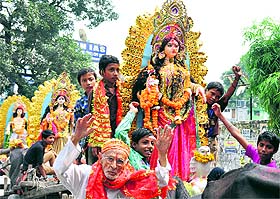   devotees celebrate Durga Puja in Dehradun on Friday. 