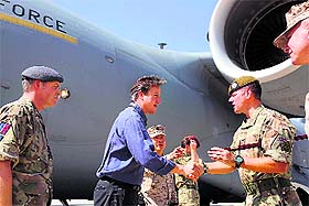 Britains Prime Minister David Cameron (2nd L) is greeted by the Garrison Sgt Major on arrival at Camp Bastion in Afghanistan on Friday.