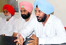 Former Congress MLA Surinderpal Singh Sibia (right) addresses mediapersons in Amritsar on Saturday
