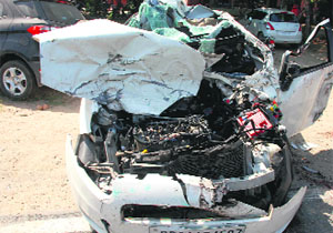 The mangled remains of a car after an accident on Bhucho Road on Saturday.