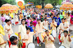 Devotees take part in Shri Sai Shobha Yatra in Chandigarh on Saturday.