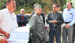 Chief Minister Virbhadra Singh inspects a construction site of an old-age care home at Basantpur in Shimla district on Saturday. Tribune photo