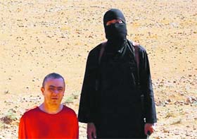 A video grab shows British worker Alan Henning moments before being beheaded by Islamic State militants.