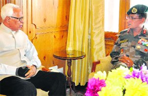 Governor NN Vohra interacts with GOC of 15 Corps Lt Gen Subrata Saha in Srinagar on Saturday.