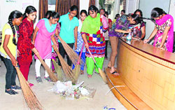 NSS volunteers clean the premises at the Guru Nanak Khalsa College for Women in Ludhiana. A Tribune photograph
