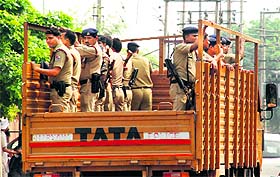 Policemen during a flag march in Panchkula on Sunday.