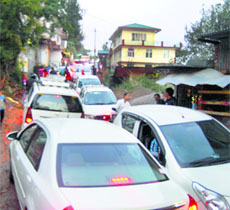 Vehicles stuck in traffic in Dharamsala on Sunday.