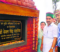 KS Pathania, Vice-Chairman, Himachal Forest Corporation, lays the foundation stone of Van Kutter Bhawan at Lipiana in Kangra on Sunday.