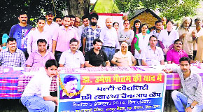 Doctors, along with late Dr Umesh Gautams family members, during a health camp at Lathiani in Una on Sunday.