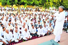 Rao Inderjit addresses a gathering at Kosli in Rewari