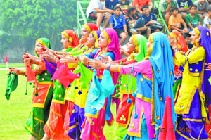 Girls perform luddi during the inauguration of the Cluster XVI Table Tennis Tournament at BCM Senior Secondary School
