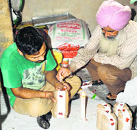 Employees seal the seized khoya.
