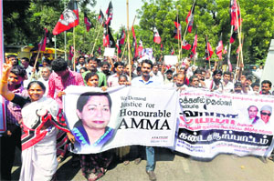Activists of the AIADMK (Delhi unit) stage a protest, demanding justice for party chief J Jayalalitha at Jantar Mantar in New Delhi on Sunday.