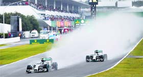 Mercedes Lewis Hamilton chases teammate Nico Rosberg after the race continued without safety car during the Japanese Grand Prix at the Suzuka Circuit on Sunday.