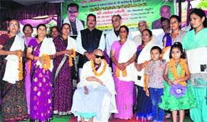 Family members of matyrs with Mussoorie MLA Ganesh Joshi during the 127th foundation day function of Garhwal Rifles in Dehradun on Sunday.