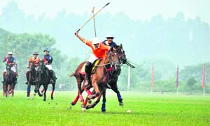 Players in action during a polo match at the Indian Military Academy in Dehradun on Sunday