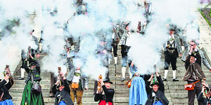 Shooters in traditional Bavarian clothes fire off salutes during the last day ceremony at Munichs Oktoberfest on Sunday. Millions of beer drinkers from around the world came to the Bavarian capital in the last two weeks for Oktoberfest.