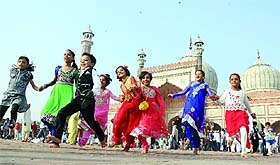 Children having a ball at the Jama Masjid after offering Eid-ul-Zuha prayers in Delhi 