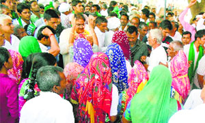 INLD leader Abhay Singh Chautala seeks blessings from elderly women at Rupana Jatan village in Ellenabad.