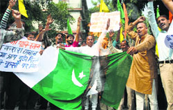 Activists of the Dogra Front burn a Pakistan flag in Jammu on Monday. A Tribune photograph