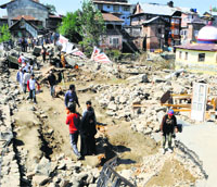 Damaged roads in the Abi Guzar area of Srinagar.Tribune Photo: Amin War