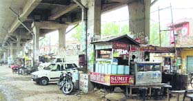 Encroachments under the railway overbridge on Tehsil Road in Jagraon.