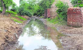 An inundated link road to a village cries for attention