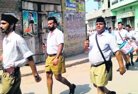 RSS cadets brandish firearms during a street march in Faridkots Jaitu town on Sunday