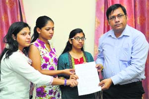 Students of Chintpurni Medical College and Hospital submit their demands to Rajesh Bagha, chairman of the state SC Commission, in Jalandhar on Monday