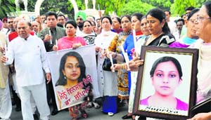 Congress leaders hold a candlelight march to seek justice for Dr Supriya, who committed suicide at DMC, Ludhiana a few days ago, in Jalandhar on Monday. 