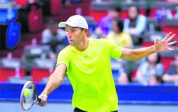 Ivo Karlovic of Croatia returns to compatriot Marin Cilic 
